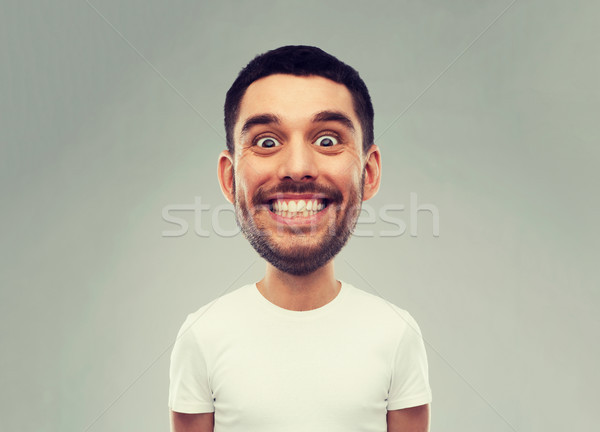 man with funny face over gray background Stock photo © dolgachov