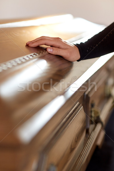 woman hand on coffin lid at funeral in church Stock photo © dolgachov