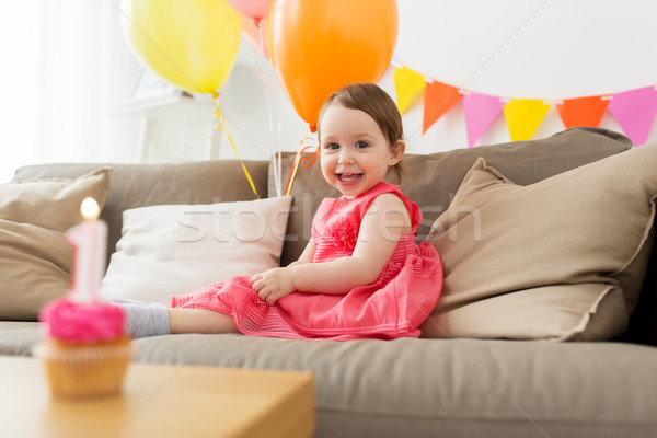 Stock photo: happy baby girl on birthday party at home