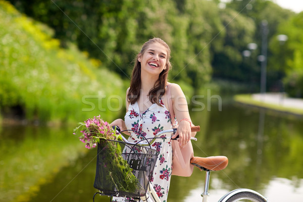 счастливым женщину верховая езда велосипед лет парка Сток-фото © dolgachov