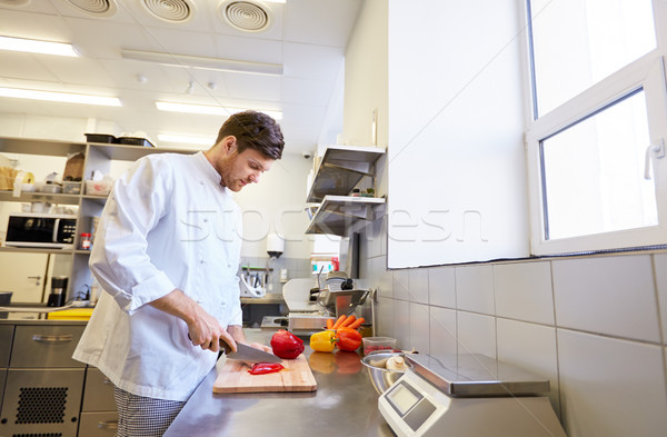 happy male chef cooking food at restaurant kitchen Stock photo © dolgachov