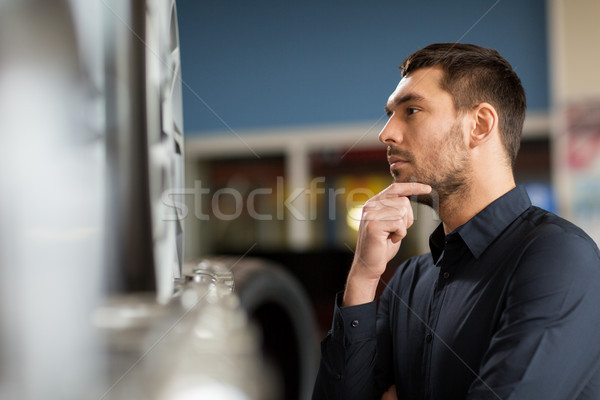 male customer choosing wheel rims at car service Stock photo © dolgachov