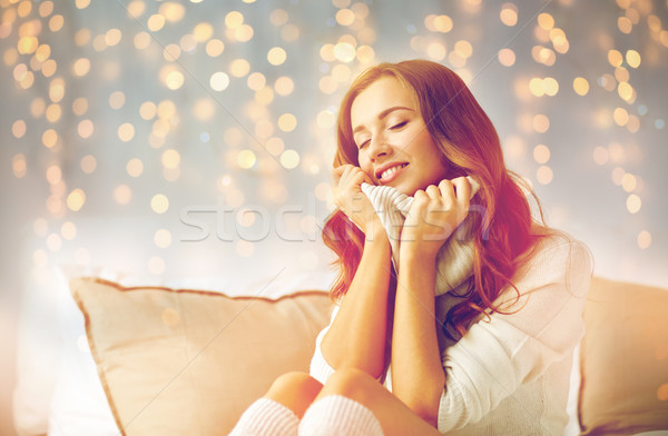 happy young woman in warm pullover at home Stock photo © dolgachov