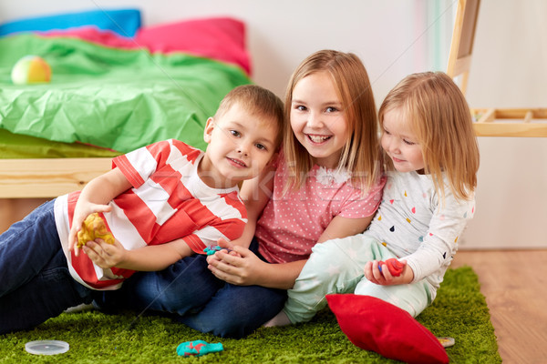 kids with modelling clay or slimes at home Stock photo © dolgachov