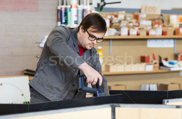 assembler with screwdriver making furniture Stock photo © dolgachov