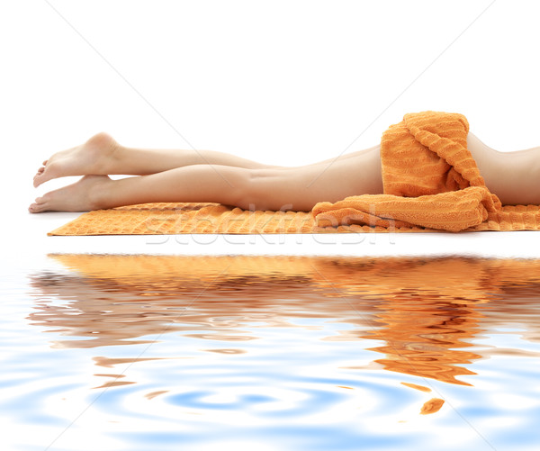 Uzun bacaklar bayan turuncu havlu Stok fotoğraf © dolgachov