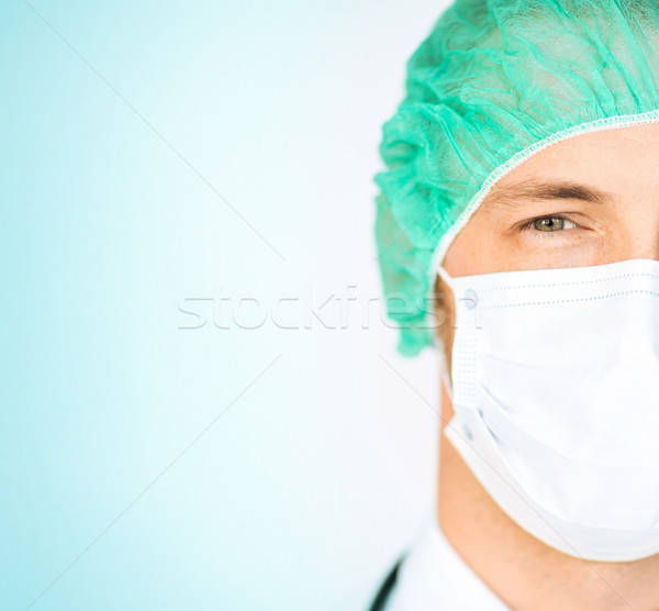 surgeon in medical cap and mask Stock photo © dolgachov