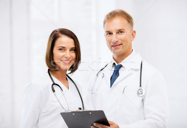 two doctors with stethoscopes Stock photo © dolgachov