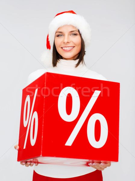 Stock photo: woman in santa helper hat with percent sign