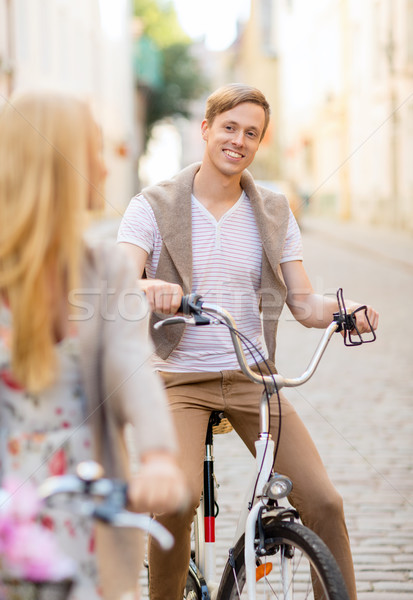 Stock photo: couple with bicycles in the city