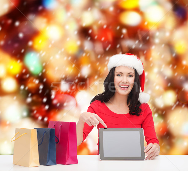 woman in santa helper hat with tablet pc Stock photo © dolgachov