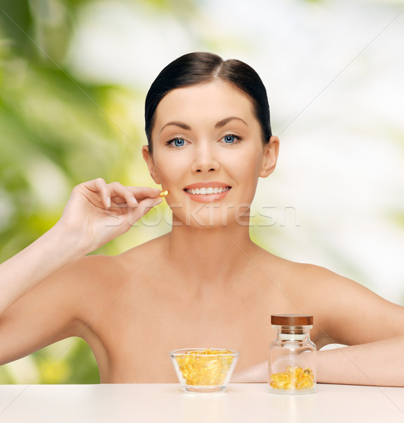 Güzel bir kadın omega 3 vitaminler sağlık güzellik kadın Stok fotoğraf © dolgachov