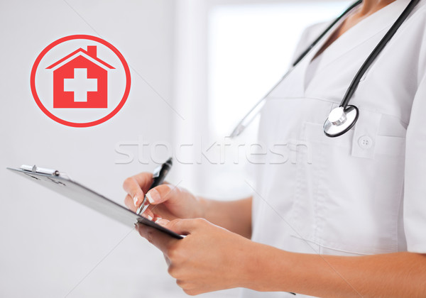 female doctor with stethoscope and prescription Stock photo © dolgachov