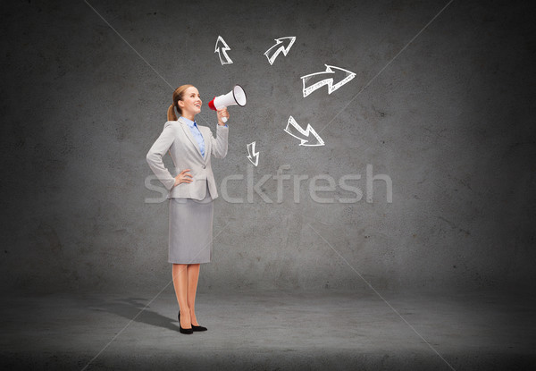 smiling businesswoman with megaphone Stock photo © dolgachov