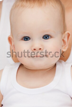 curious baby lying on floor and looking up Stock photo © dolgachov