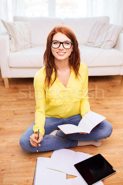 smiling teenage girl with tablet pc at home Stock photo © dolgachov