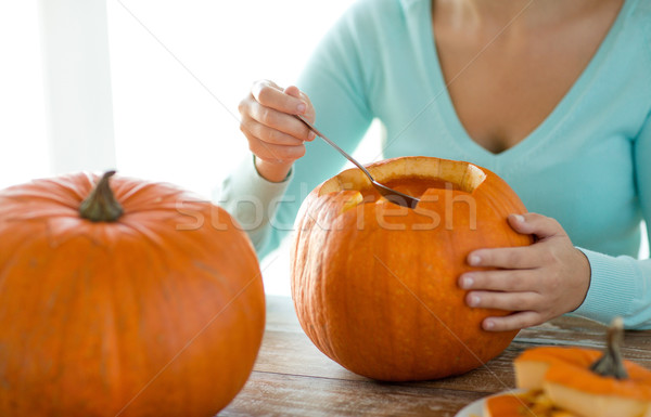 close up of woman with pumpkins at home Stock photo © dolgachov