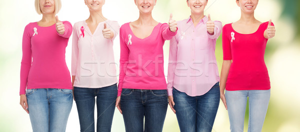 Stock photo: close up of women with cancer awareness ribbons