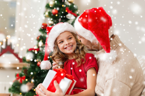 smiling father and daughter holding gift box Stock photo © dolgachov