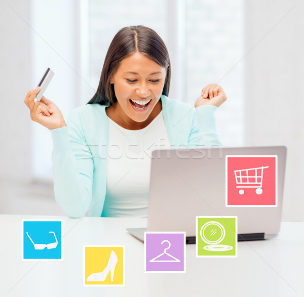 Stock photo: happy businesswoman with laptop and credit card