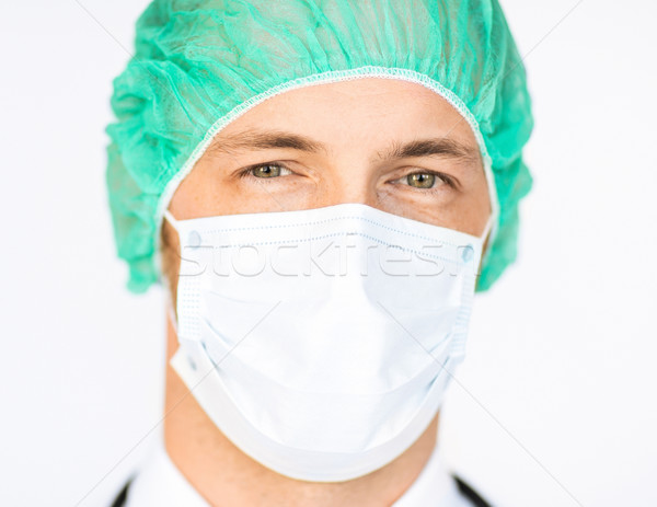 surgeon in medical cap and mask Stock photo © dolgachov
