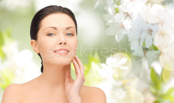 beautiful young woman touching her face Stock photo © dolgachov