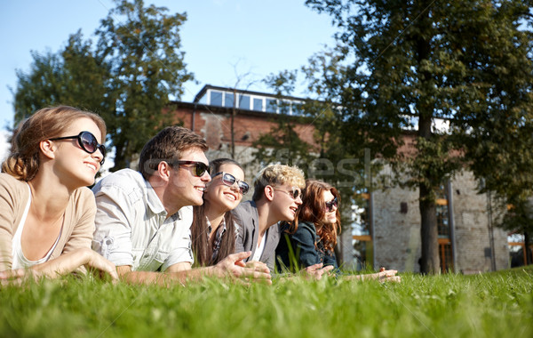 group of students or teenagers hanging out Stock photo © dolgachov