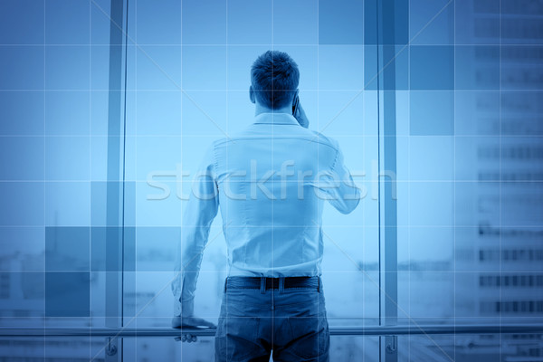 businessman calling on smartphone in office Stock photo © dolgachov