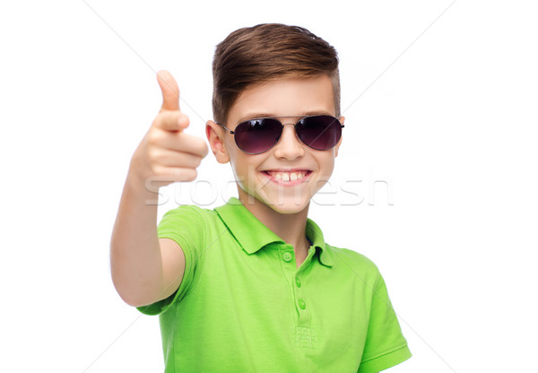 smiling boy in sunglasses and green polo t-shirt Stock photo © dolgachov