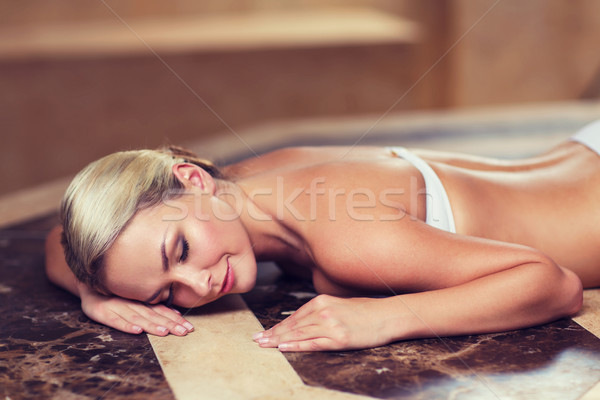 young woman lying on hammam table in turkish bath Stock photo © dolgachov