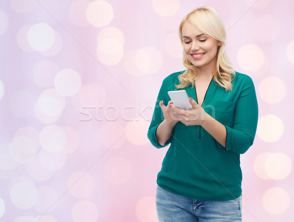 happy woman with smartphone texting message Stock photo © dolgachov