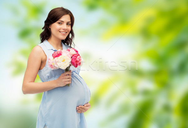 Glücklich Blumen anfassen Bauch Schwangerschaft Stock foto © dolgachov