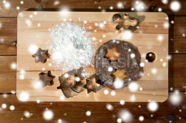 close up of ginger dough, molds and flour on board Stock photo © dolgachov