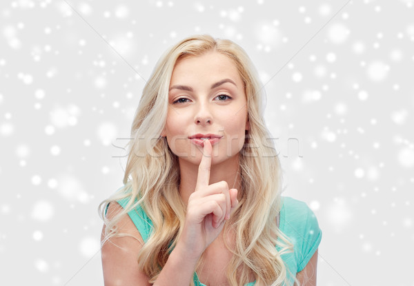 Piękna młoda kobieta palec usta ludzi Zdjęcia stock © dolgachov