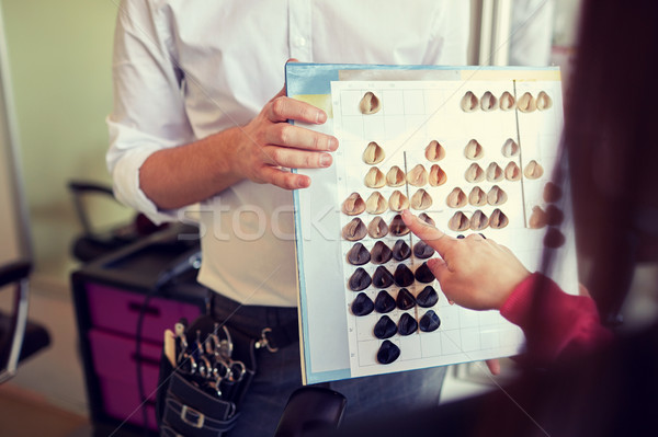 woman choosing hair color from palette at salon Stock photo © dolgachov