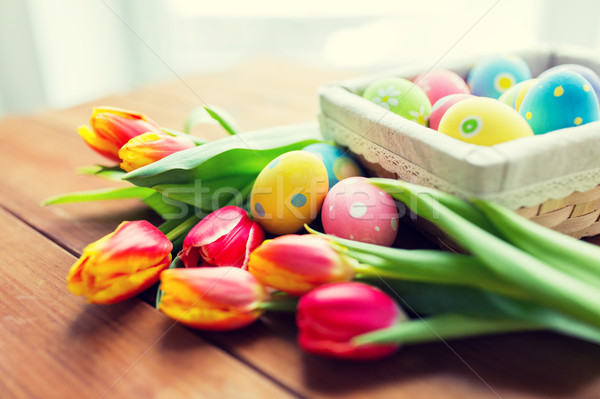 close up of colored easter eggs and flowers Stock photo © dolgachov