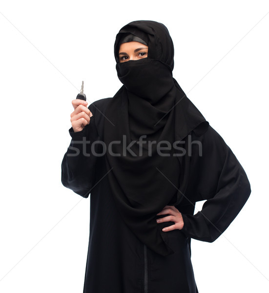 muslim woman in hijab with car key over white Stock photo © dolgachov