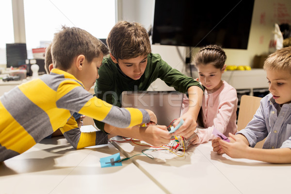 kids with invention kit at robotics school Stock photo © dolgachov