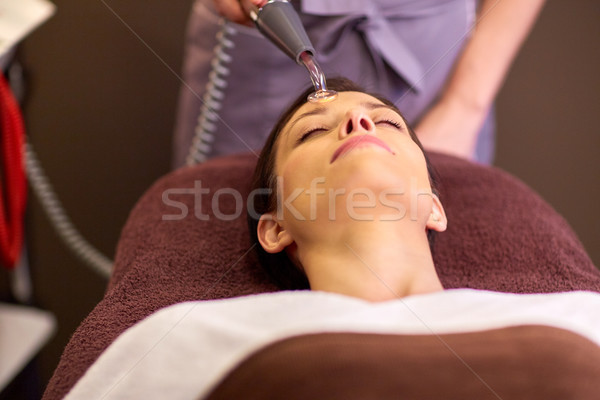 woman having hydradermie facial treatment in spa Stock photo © dolgachov
