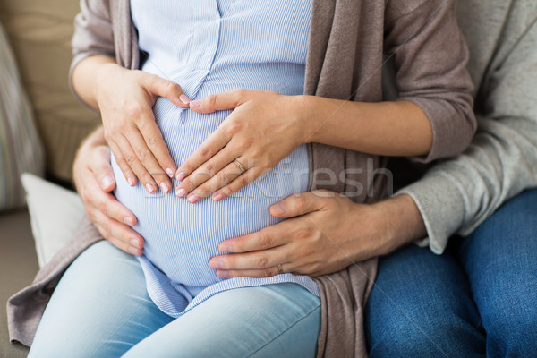 close up of pregnant woman making hand heart Stock photo © dolgachov