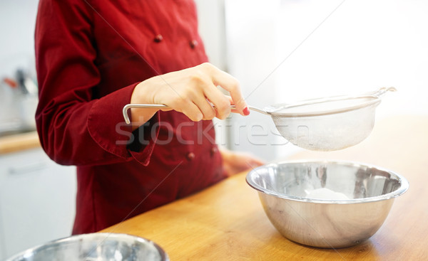 Stock photo: chef with flour in bowl making batter or dough