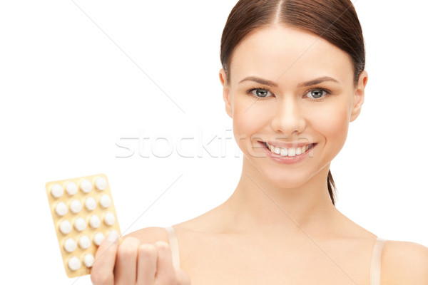 young beautiful woman with pills  Stock photo © dolgachov