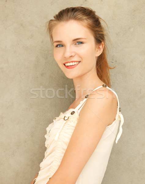 happy and smiling teenage girl Stock photo © dolgachov