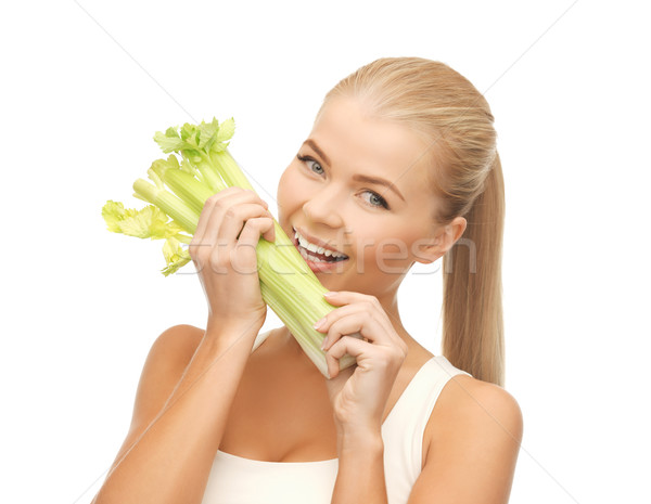 Stock photo: woman biting piece of celery or green salad