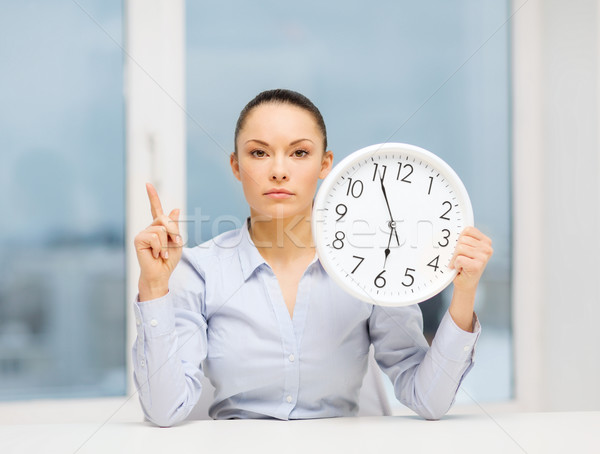 Stock photo: attractive businesswoman with white clock