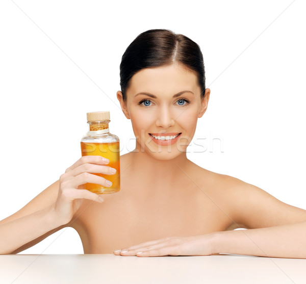 beautiful woman with oil bottle Stock photo © dolgachov