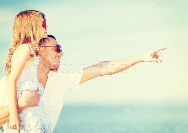 happy father and child in sunglasses over blue sky Stock photo © dolgachov