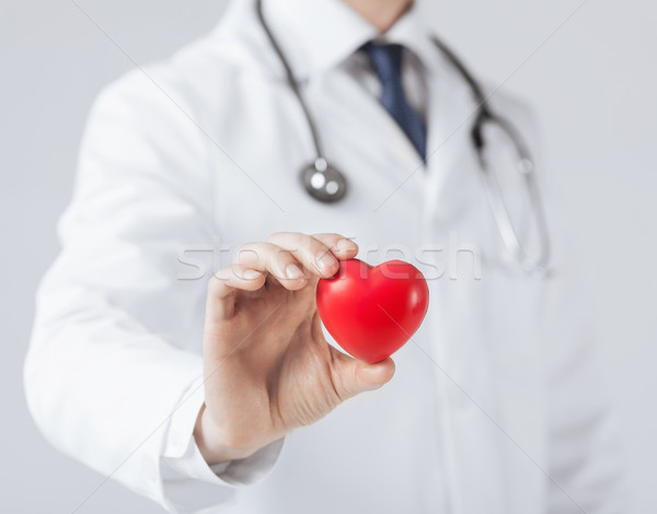 Uomo mani cuore famiglia medici Foto d'archivio © dolgachov