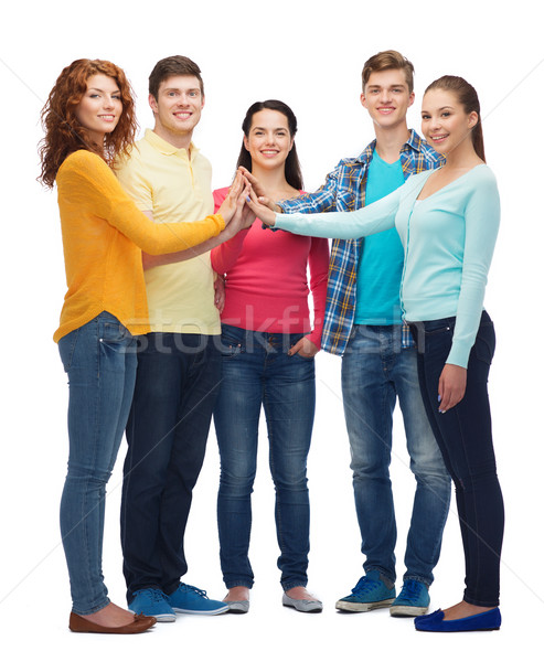 Grupy uśmiechnięty nastolatków high five przyjaźni Zdjęcia stock © dolgachov