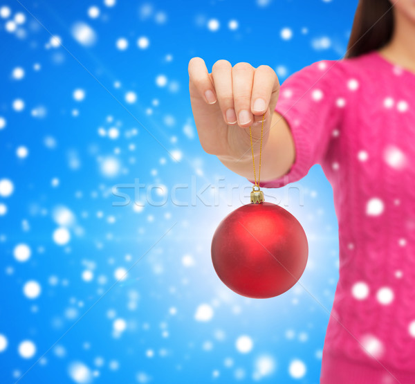 close up of woman in sweater with christmas ball Stock photo © dolgachov